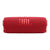 Bocina JBL Flip 7 roja, portátil, resistente al agua y al polvo, con correa extraíble y logo JBL en relieve.